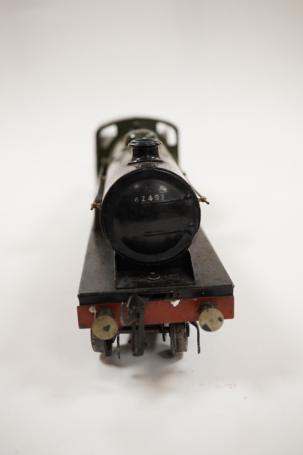 An 0 gauge Bassett-Lowke clockwork tinplate BR 4-4-0 tender locomotive, Prince Charles 62453, in dark green livery with orange and black lining and original clockwork mechanism